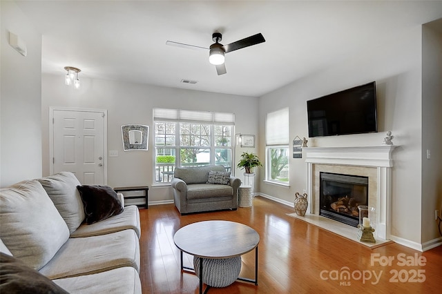 13610 Aldenbrook Dr, Huntersville, NC 28078 - living area featuring ceiling fan, wood finished floors, a high end fireplace, and baseboards