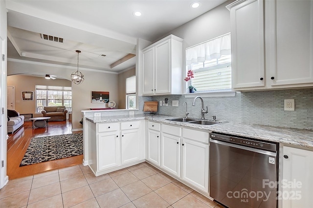 13610 Aldenbrook Dr, Huntersville, NC 28078 - kitchen featuring dishwasher, a sink, a raised ceiling, open floor plan, and a peninsula