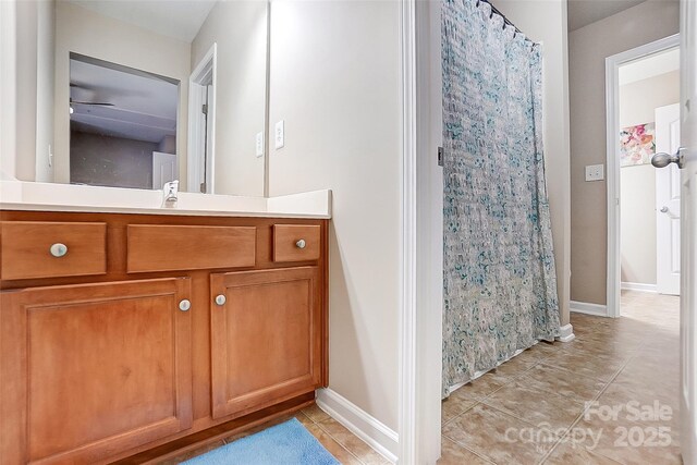 13610 Aldenbrook Dr, Huntersville, NC 28078 - bathroom featuring tile patterned floors, baseboards, vanity, and a shower with curtain