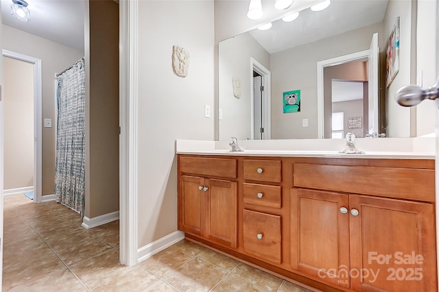 13610 Aldenbrook Dr, Huntersville, NC 28078 - full bath with tile patterned flooring, double vanity, and baseboards