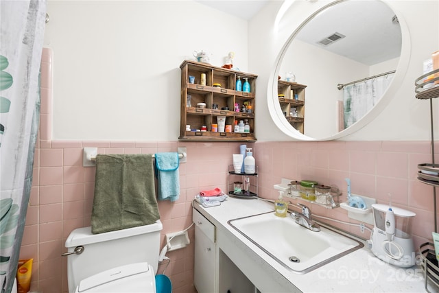 1204 Meadowood Dr, Shelby, NC 28150 - bathroom with wainscoting, visible vents, and tile walls