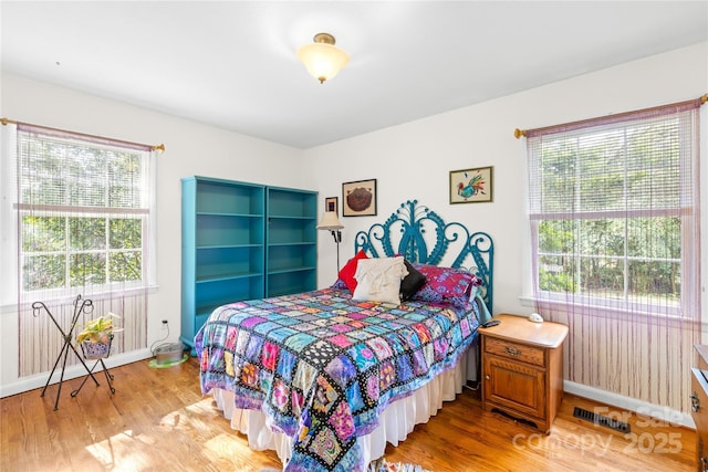 1204 Meadowood Dr, Shelby, NC 28150 - bedroom featuring wood finished floors, baseboards, and visible vents
