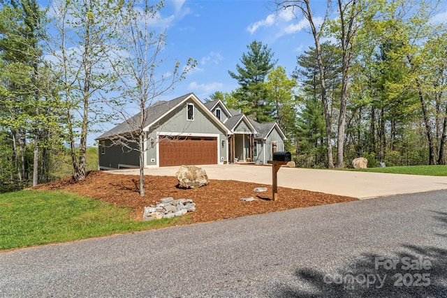 44 Sycamore Dr, Nebo, NC 28761 - craftsman-style house with an attached garage, board and batten siding, and driveway