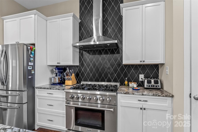 44 Sycamore Dr, Nebo, NC 28761 - kitchen featuring wall chimney exhaust hood, backsplash, and appliances with stainless steel finishes