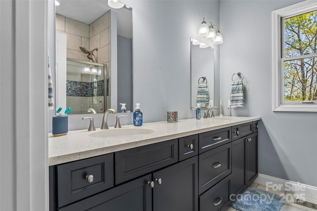 44 Sycamore Dr, Nebo, NC 28761 - bathroom featuring a shower stall, double vanity, baseboards, and a sink