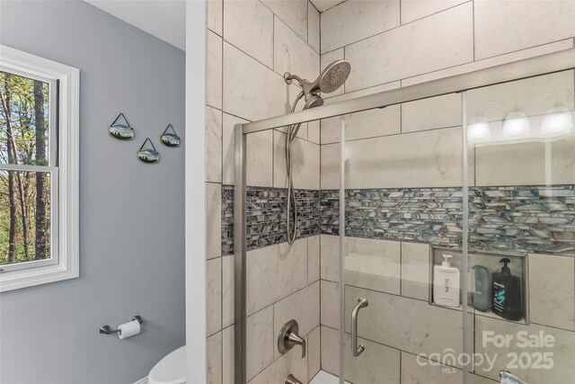 44 Sycamore Dr, Nebo, NC 28761 - full bathroom featuring tiled shower / bath combo and toilet