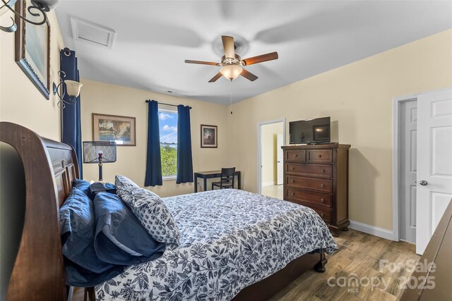 44 Sycamore Dr, Nebo, NC 28761 - bedroom featuring ceiling fan, baseboards, attic access, and wood finished floors