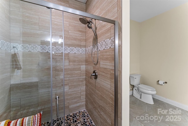 44 Sycamore Dr, Nebo, NC 28761 - bathroom featuring toilet, a stall shower, and baseboards