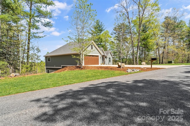 44 Sycamore Dr, Nebo, NC 28761 - view of front of property with a front yard, driveway, and a garage