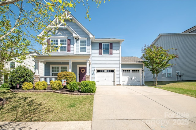 craftsman inspired home with a porch, a front lawn, and concrete driveway