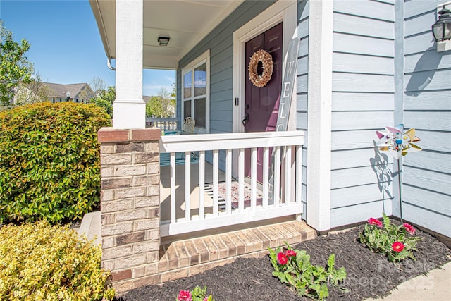 property entrance featuring covered porch
