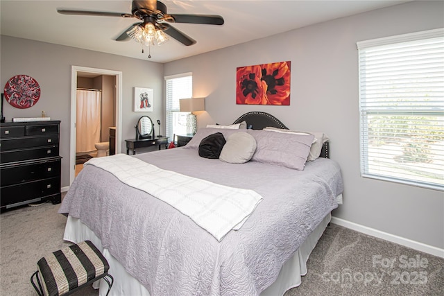 bedroom with ensuite bathroom, baseboards, a ceiling fan, and carpet floors
