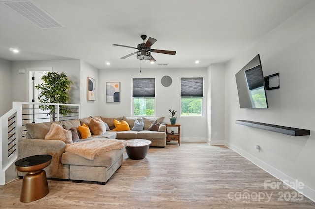living area featuring ceiling fan, recessed lighting, baseboards, light wood-type flooring, and visible vents