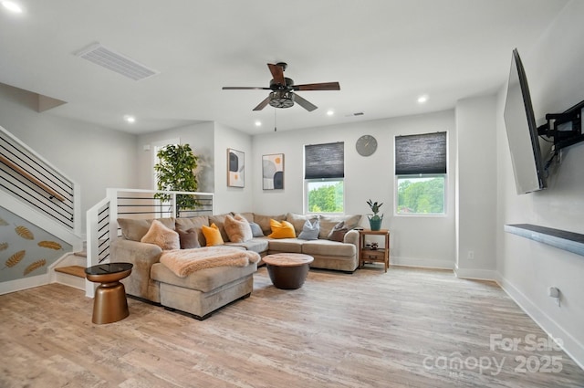 living room featuring a ceiling fan, recessed lighting, light wood-style flooring, and visible vents