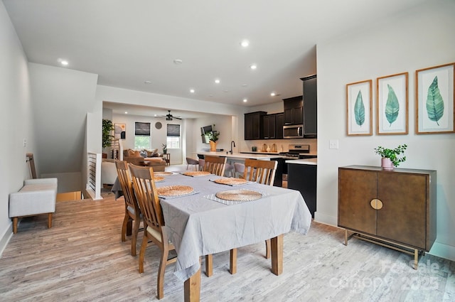 dining space with recessed lighting, baseboards, ceiling fan, and light wood-type flooring