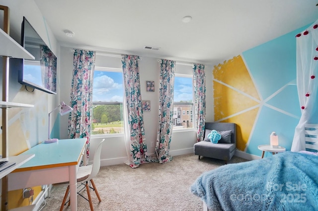 carpeted bedroom with visible vents and baseboards