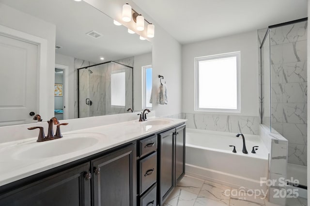 bathroom featuring visible vents, a sink, marble finish floor, and a stall shower