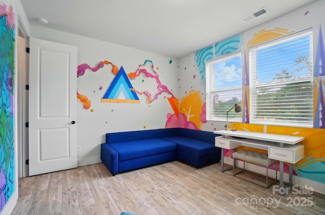 playroom with wood finished floors and visible vents