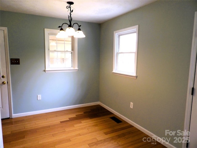 106 Pinetree Dr, Black Mountain, NC 28711 - unfurnished room featuring visible vents, wood finished floors, and baseboards