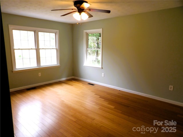106 Pinetree Dr, Black Mountain, NC 28711 - empty room featuring ceiling fan, baseboards, wood finished floors, and visible vents