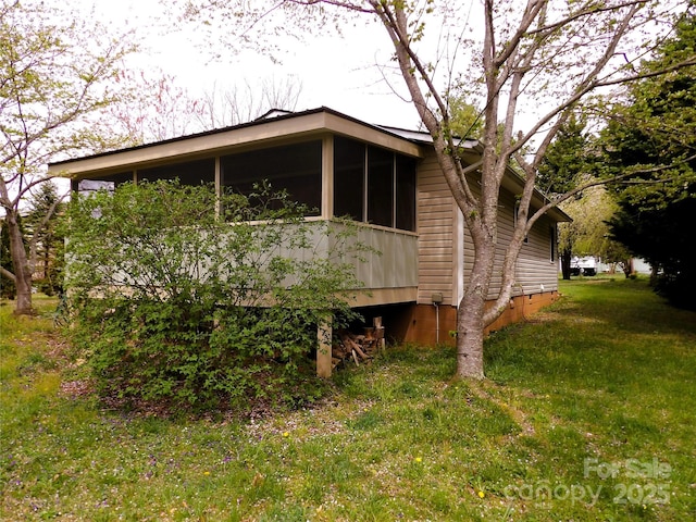 106 Pinetree Dr, Black Mountain, NC 28711 - view of home's exterior featuring a yard and a sunroom