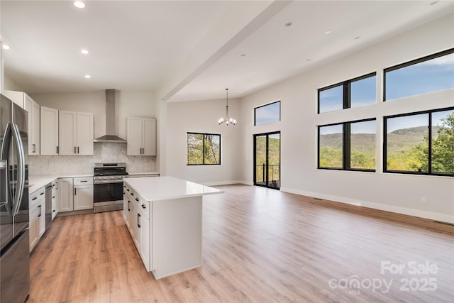 175 Silverglen Way, Hendersonville, NC 28792 - kitchen featuring decorative backsplash, a center island, stainless steel appliances, recessed lighting, and wall chimney exhaust hood