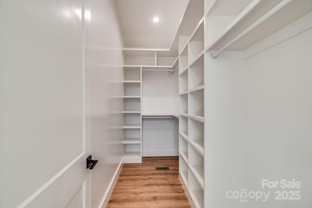 175 Silverglen Way, Hendersonville, NC 28792 - walk in closet with visible vents and wood finished floors