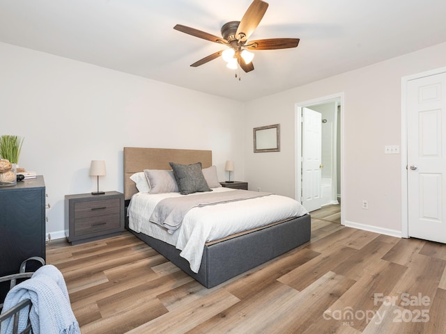 1203 Maple Shade Ln, Charlotte, NC 28270 - bedroom with light wood-style floors, baseboards, connected bathroom, and a ceiling fan