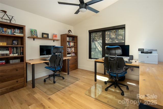 home office featuring ceiling fan, wood finished floors, lofted ceiling, and baseboards