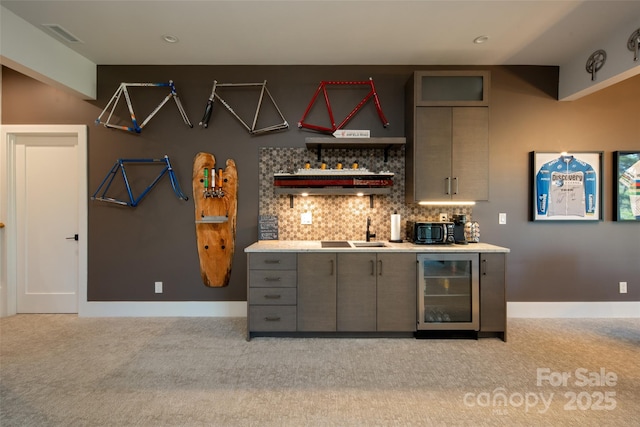 bar featuring beverage cooler, light colored carpet, indoor bar, and backsplash