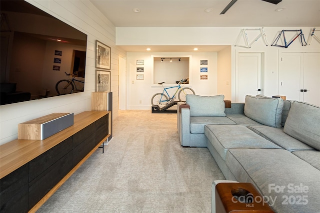 carpeted living room featuring recessed lighting