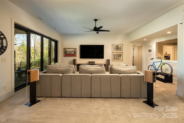 living room with visible vents, ceiling fan, light colored carpet, and recessed lighting