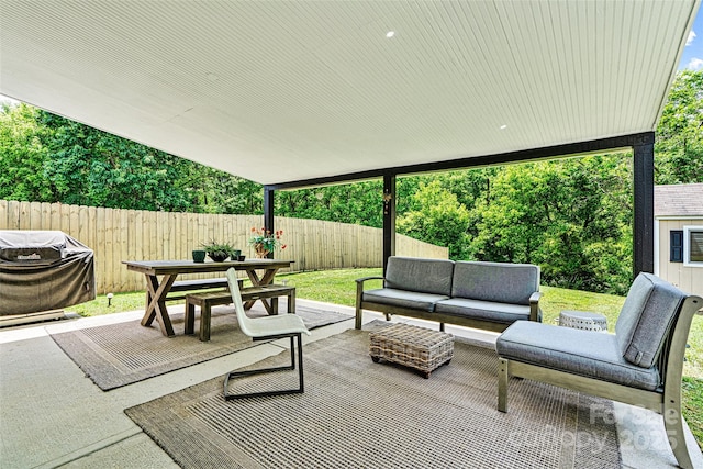 view of patio / terrace with a fenced backyard, outdoor dining space, area for grilling, and outdoor lounge area