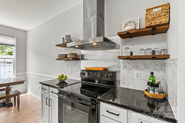 kitchen with open shelves, tasteful backsplash, wall chimney exhaust hood, and black range with electric stovetop