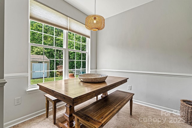 dining room with a healthy amount of sunlight and baseboards