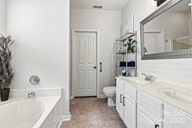 full bath featuring double vanity, a garden tub, visible vents, a sink, and toilet