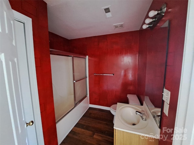 2527 Carya Pond Ln, Charlotte, NC 28212 - full bathroom featuring visible vents, toilet, vanity, and wood finished floors