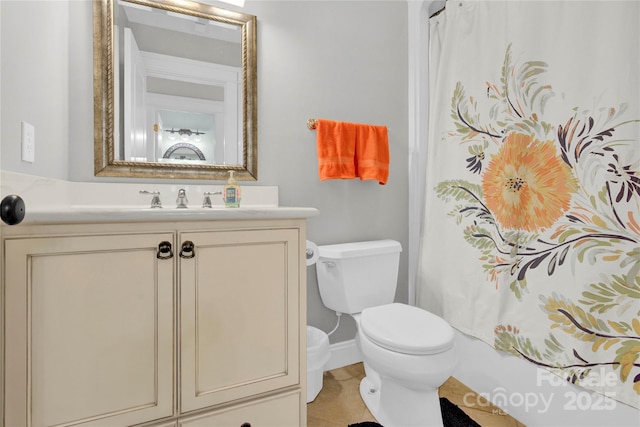 bathroom with baseboards, vanity, curtained shower, and toilet