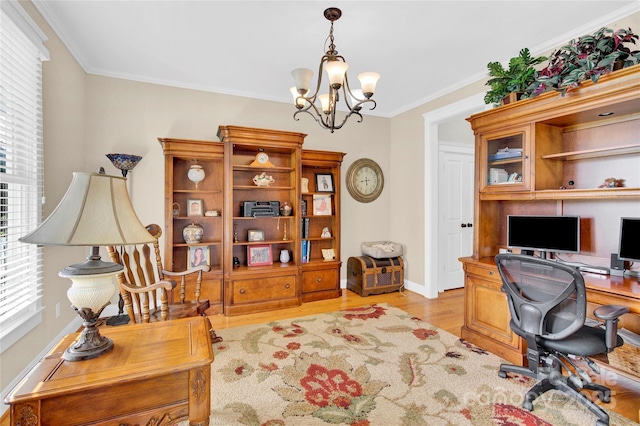 office space with light wood-type flooring, baseboards, ornamental molding, and an inviting chandelier