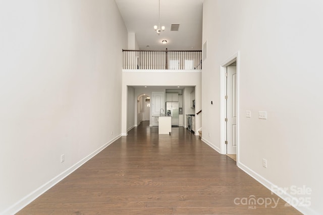 5684 Garrow Glen Rd Unit 96, Charlotte, NC 28278 - hall with visible vents, baseboards, dark wood finished floors, and a high ceiling