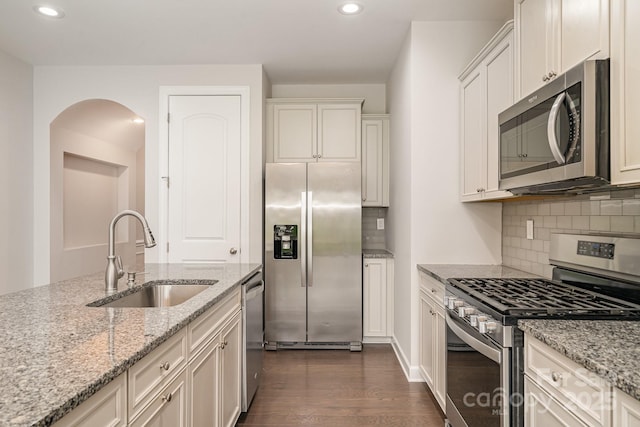5684 Garrow Glen Rd Unit 96, Charlotte, NC 28278 - kitchen featuring recessed lighting, a sink, decorative backsplash, dark wood-type flooring, and appliances with stainless steel finishes
