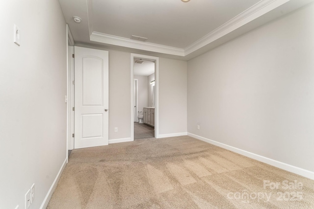 5684 Garrow Glen Rd Unit 96, Charlotte, NC 28278 - unfurnished bedroom featuring connected bathroom, crown molding, visible vents, baseboards, and carpet floors