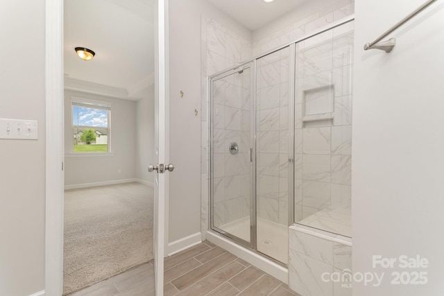 5684 Garrow Glen Rd Unit 96, Charlotte, NC 28278 - full bathroom featuring baseboards, wood finished floors, and a shower stall