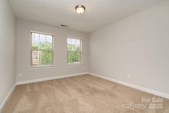 5684 Garrow Glen Rd Unit 96, Charlotte, NC 28278 - carpeted spare room with baseboards and visible vents