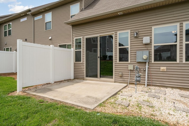5684 Garrow Glen Rd Unit 96, Charlotte, NC 28278 - back of house with fence, a shingled roof, and a patio