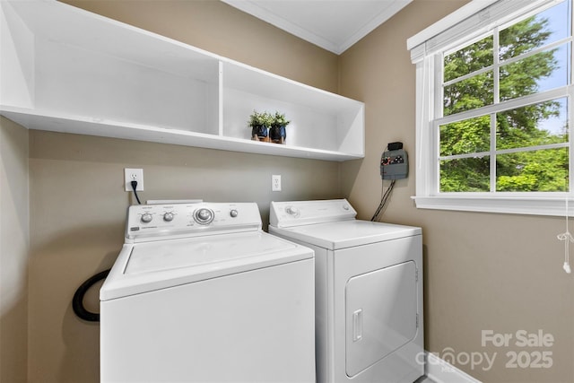 laundry room with washer and clothes dryer, laundry area, ornamental molding, and baseboards