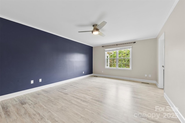 unfurnished room featuring crown molding, baseboards, a ceiling fan, and light wood finished floors