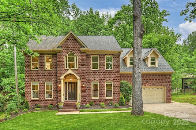 7067 Rocky Falls Rd, Charlotte, NC 28211 - colonial inspired home with brick siding, concrete driveway, a shingled roof, and a garage