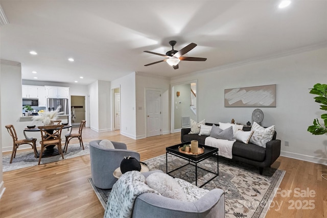 7067 Rocky Falls Rd, Charlotte, NC 28211 - living area with ceiling fan, baseboards, light wood-style flooring, recessed lighting, and ornamental molding