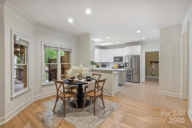 7067 Rocky Falls Rd, Charlotte, NC 28211 - dining room featuring ornamental molding, recessed lighting, baseboards, and light wood finished floors
